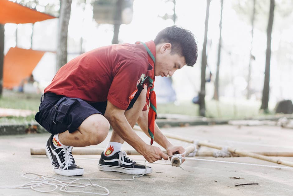 Young scouts outdoors in a small learning group
