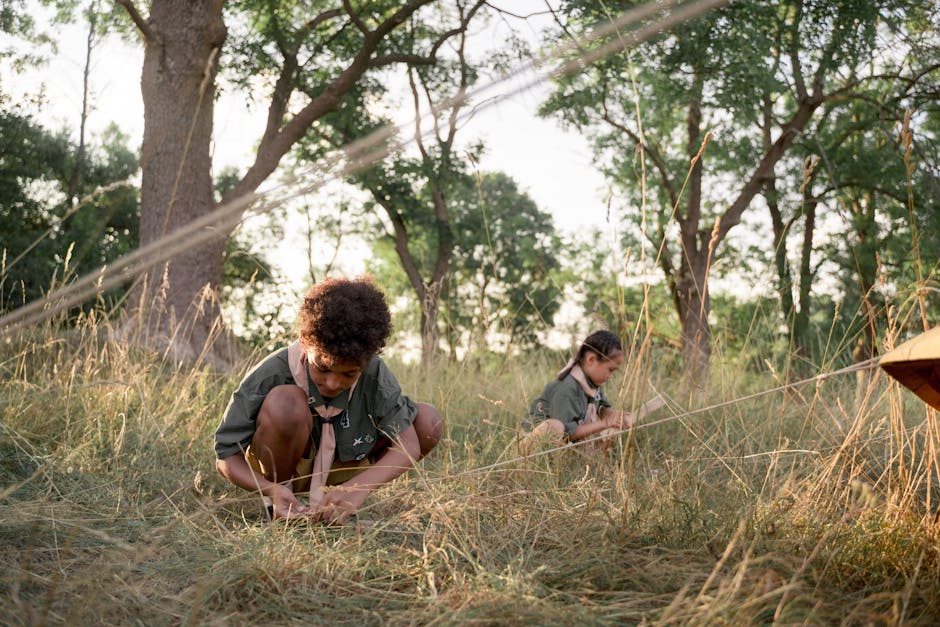 Youth scouts working together in the field